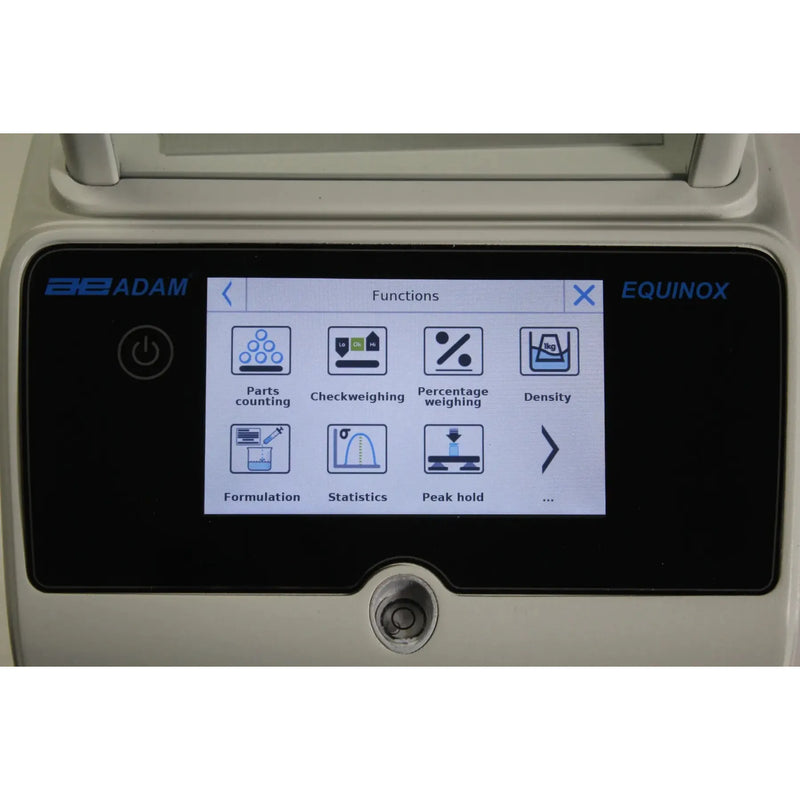 Device on lab bench with draft shield visible of Kern professional weighing scale