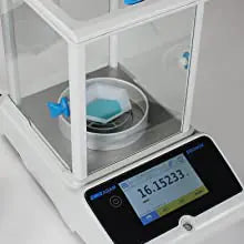 Analytical balance with glass draft shield open of Kern analytical scale