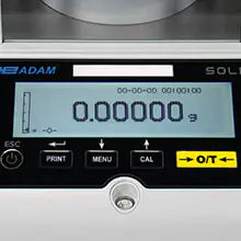 Digital lab scale with printed calibration certificate beside it of Kern professional weighing scale
