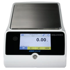 Digital lab scale with printed calibration certificate beside it of Kern high-accuracy weighing device